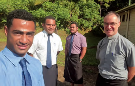 Fr. Colgan and three seminarians